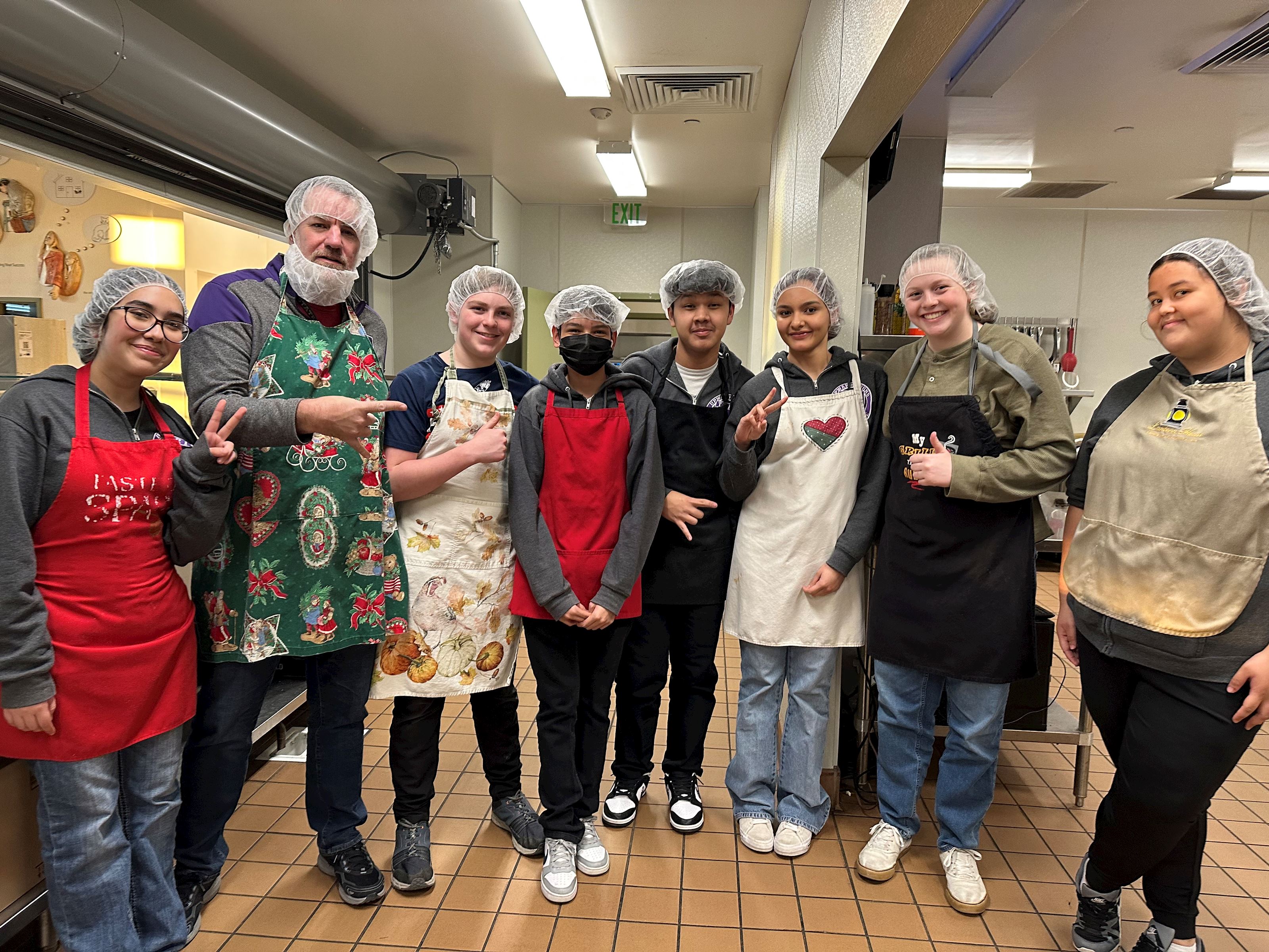 students volunteering at the soup kitchen