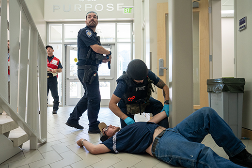 First responders treat a victim of a multiagency active shooter response training