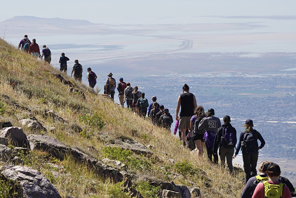 Students hike the hills of Mount Ogden with scenic views all around