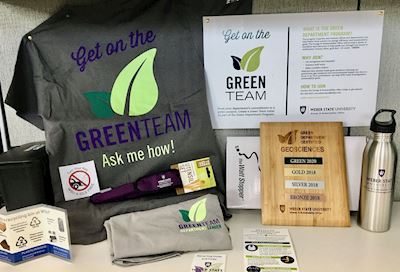 A display of some Green Team merchandise and swag. 