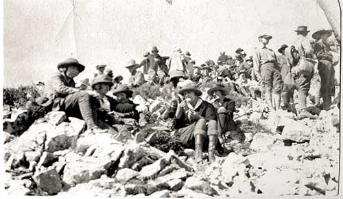 Hikers rest on the 1922 Mount Ogden Hike